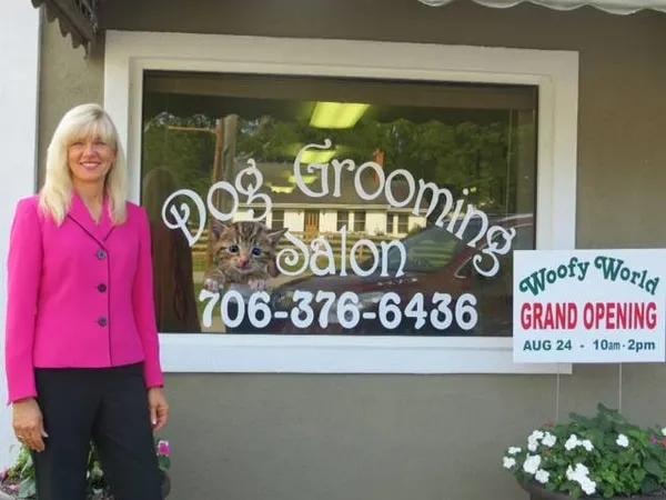 Cheryl standing in front of the Woofy World Dog Grooming Salon